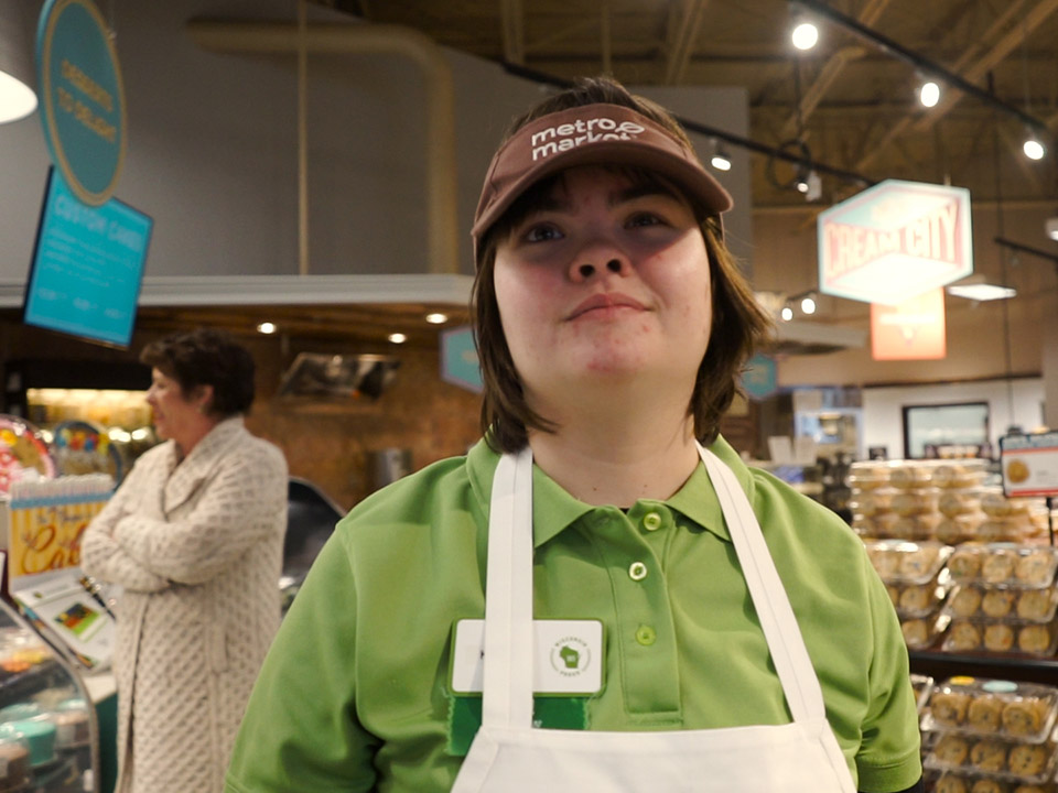 Woman with a developmental disability working at a grocery store